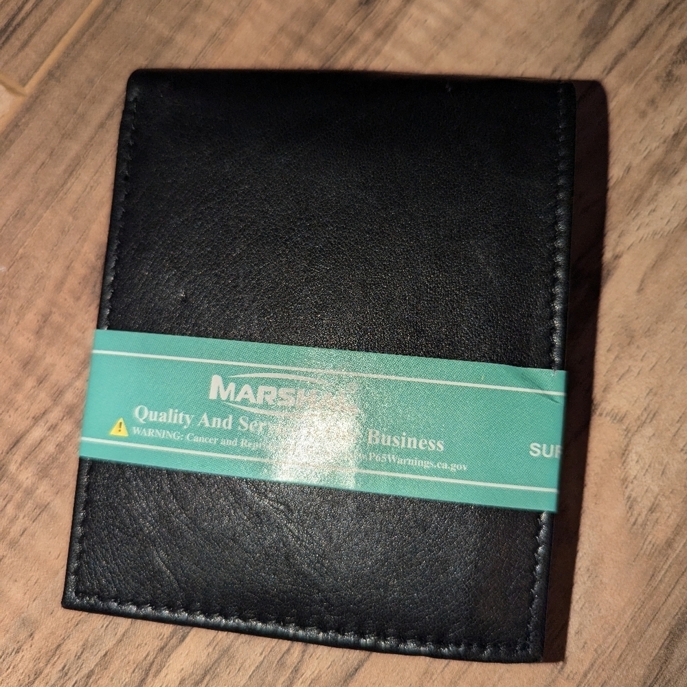 NWT. Black Marshal bi fold wallet with lots of storage.